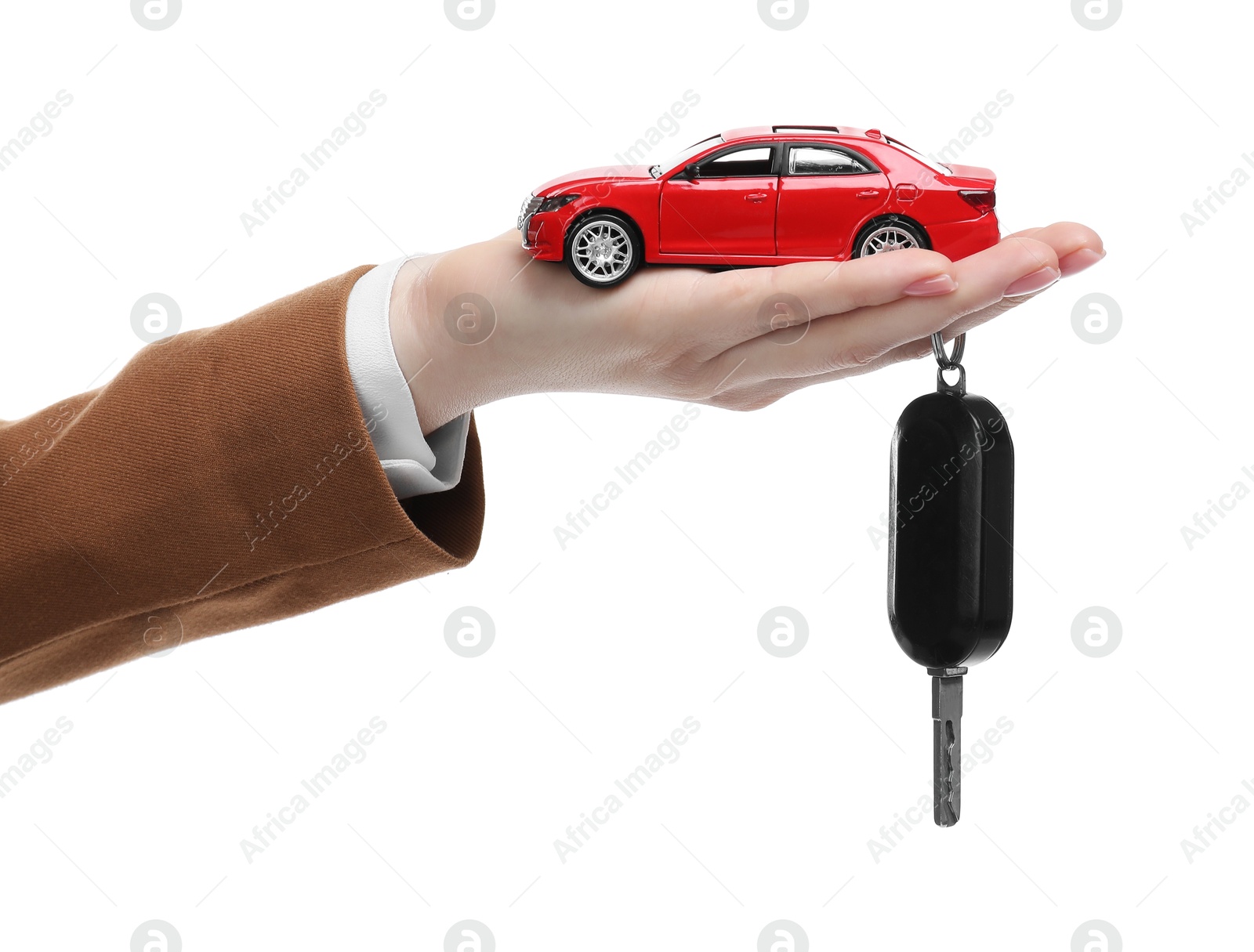 Photo of Woman with car model and key on white background, closeup. Buying auto