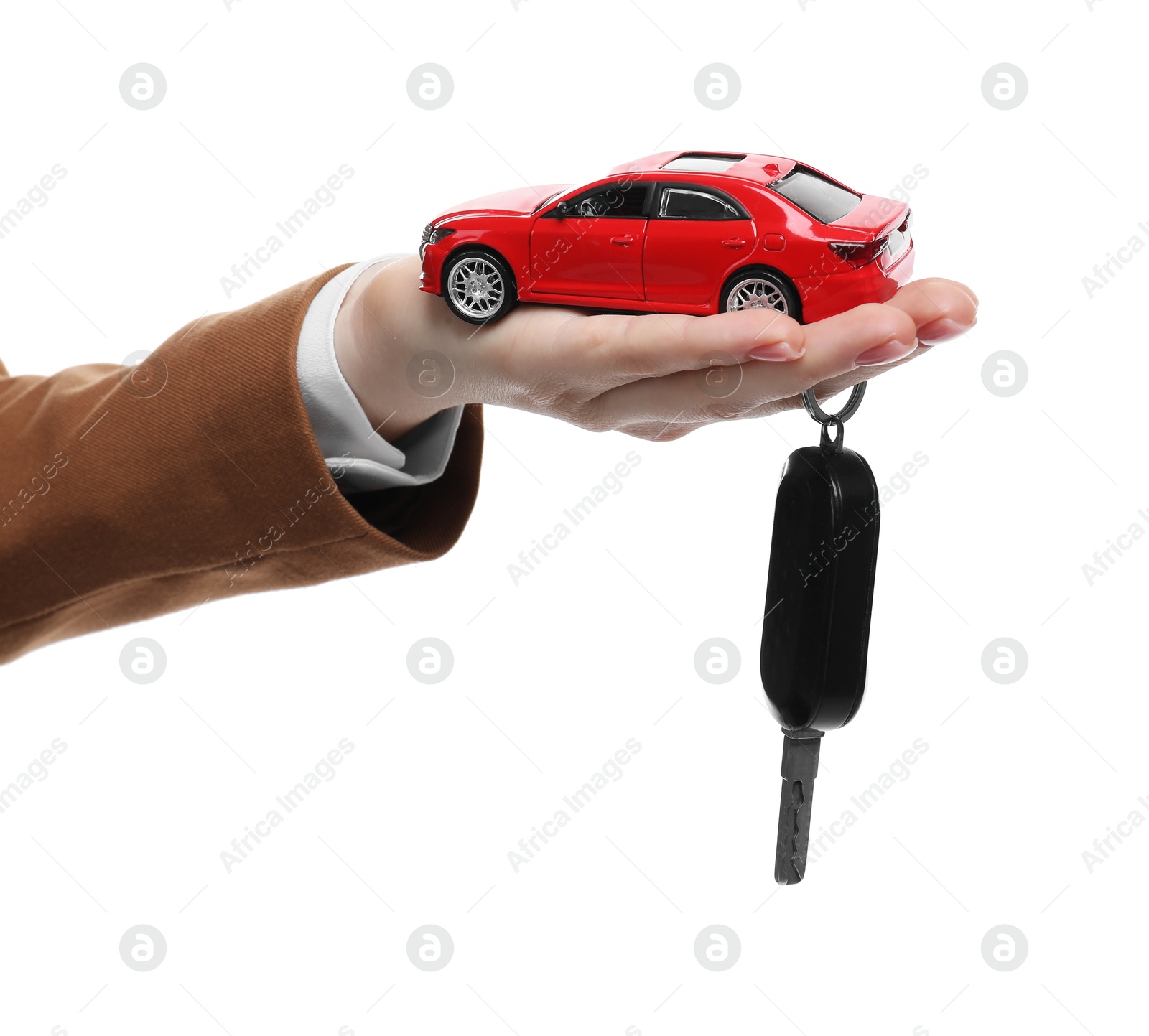 Photo of Woman with car model and key on white background, closeup. Buying auto