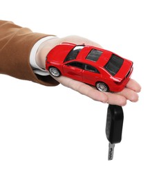 Photo of Woman with car model and key on white background, closeup. Buying auto