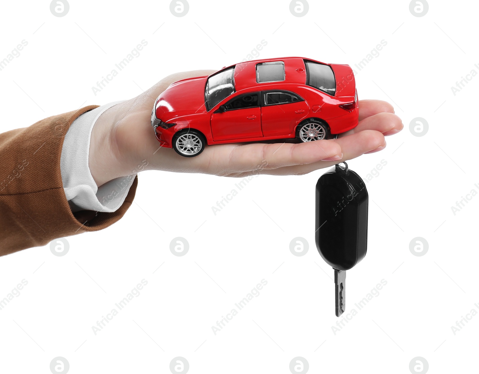 Photo of Woman with car model and key on white background, closeup. Buying auto