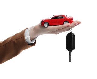 Photo of Woman with car model and key on white background, closeup. Buying auto