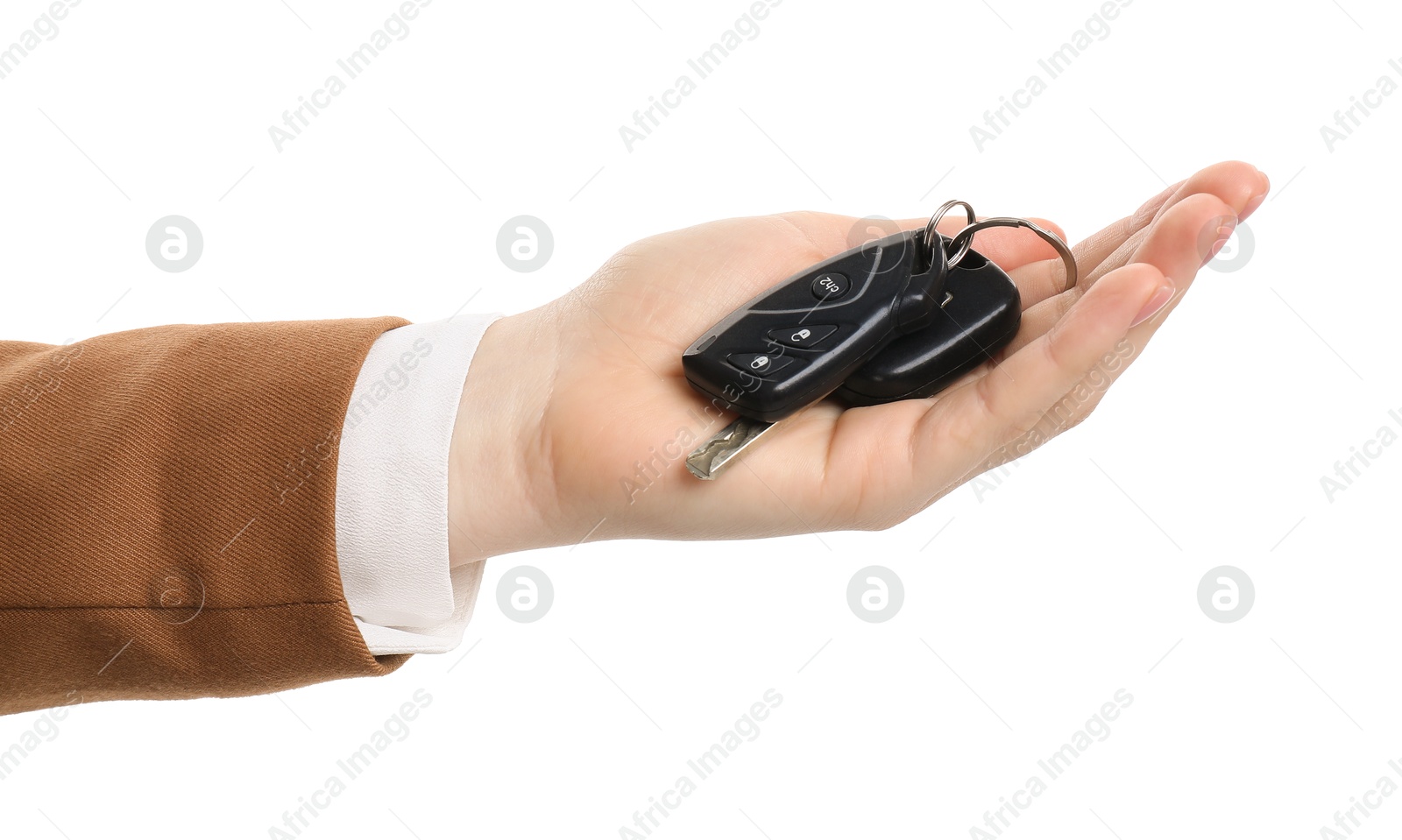 Photo of Woman with car keys on white background, closeup. Buying auto