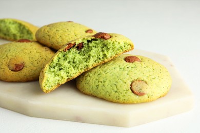 Photo of Delicious mint chocolate chip cookies on white table, closeup