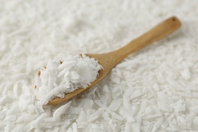 Photo of White soy wax flakes and spoon, closeup