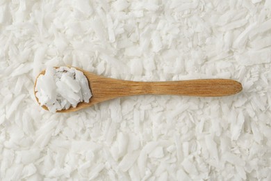 Photo of White soy wax flakes and spoon, top view