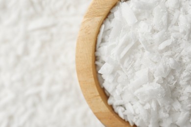 Photo of White soy wax flakes and bowl, top view