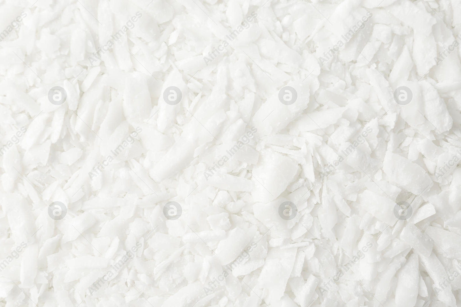 Photo of White soy wax flakes as background, closeup