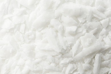 Photo of White soy wax flakes as background, closeup