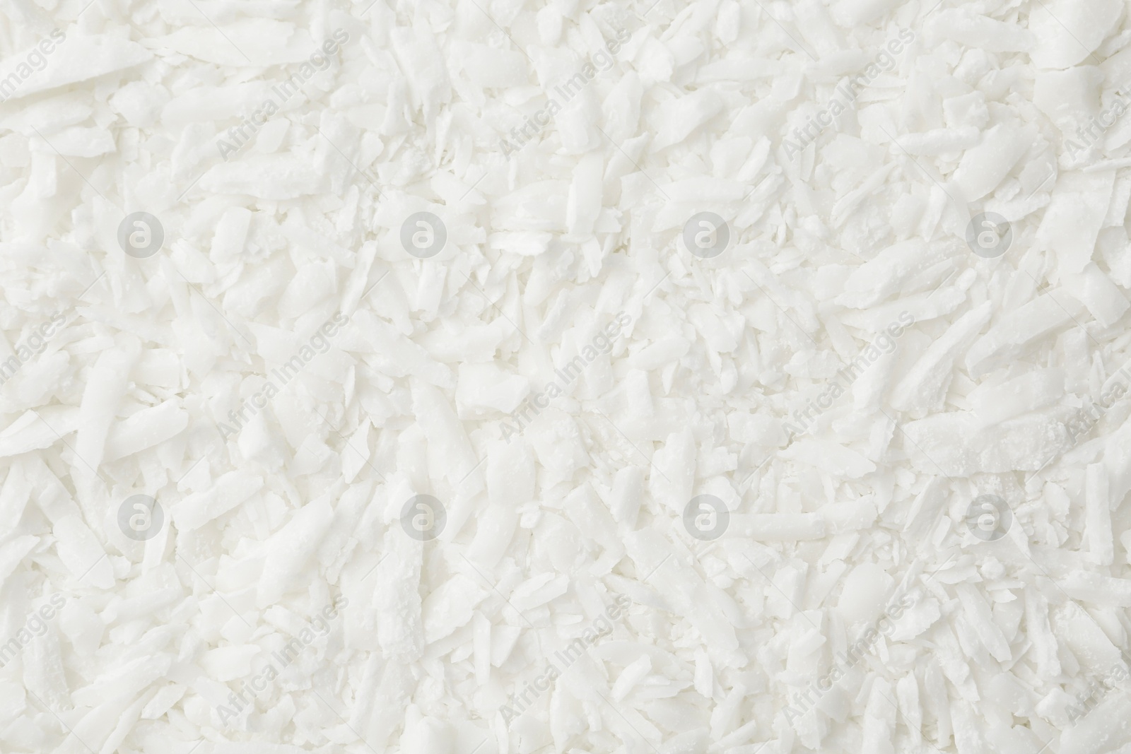 Photo of White soy wax flakes as background, closeup