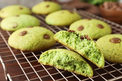 Photo of Delicious mint chocolate chip cookies on wooden table, closeup