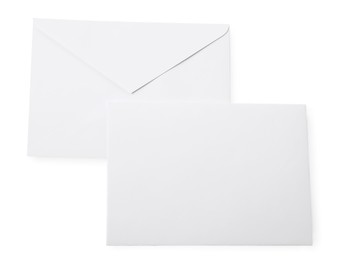 Photo of Envelopes isolated on white, top view. Mockup for design