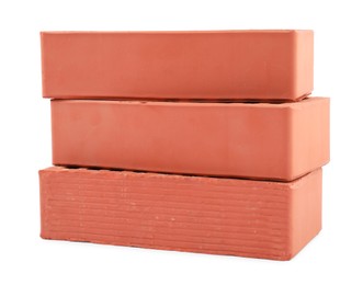 Photo of Red bricks isolated on white. Construction material