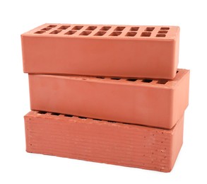 Photo of Red bricks isolated on white. Construction material