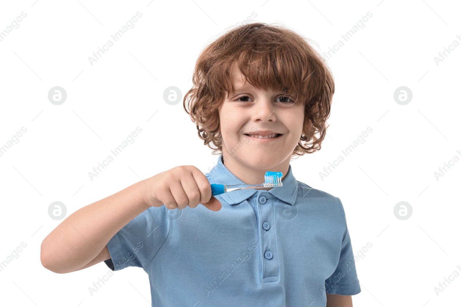 Photo of Cute boy with toothbrush and toothpaste on white background