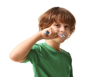 Cute boy brushing his teeth on white background