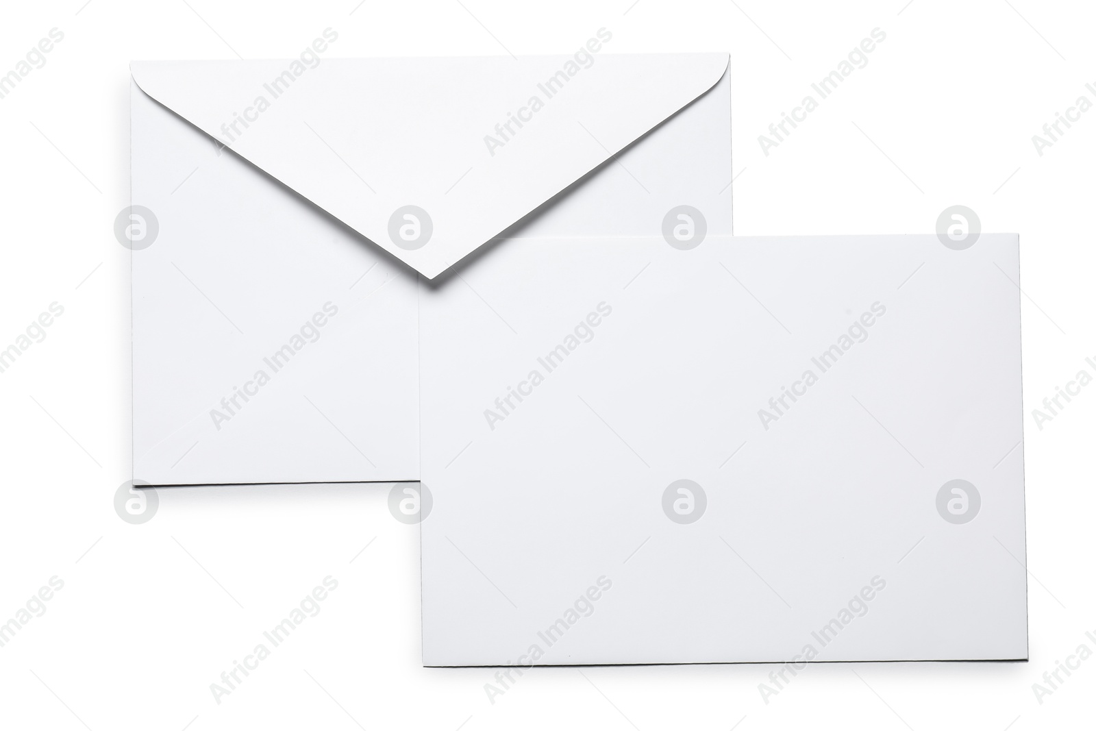 Photo of Envelopes isolated on white, top view. Mockup for design