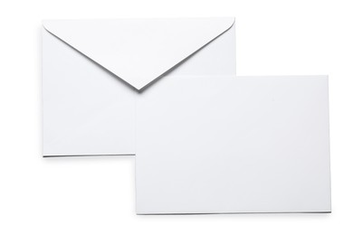 Photo of Envelopes isolated on white, top view. Mockup for design