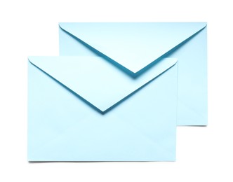 Photo of Blue envelopes isolated on white, top view. Mockup for design