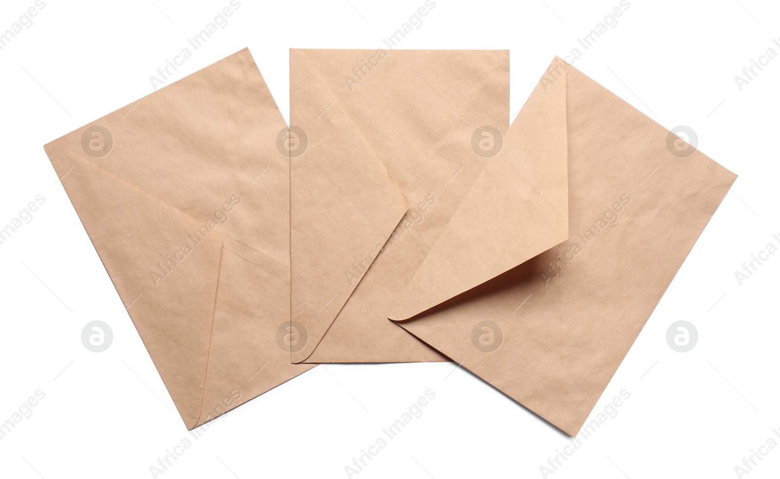 Photo of Envelopes isolated on white, top view. Mockup for design