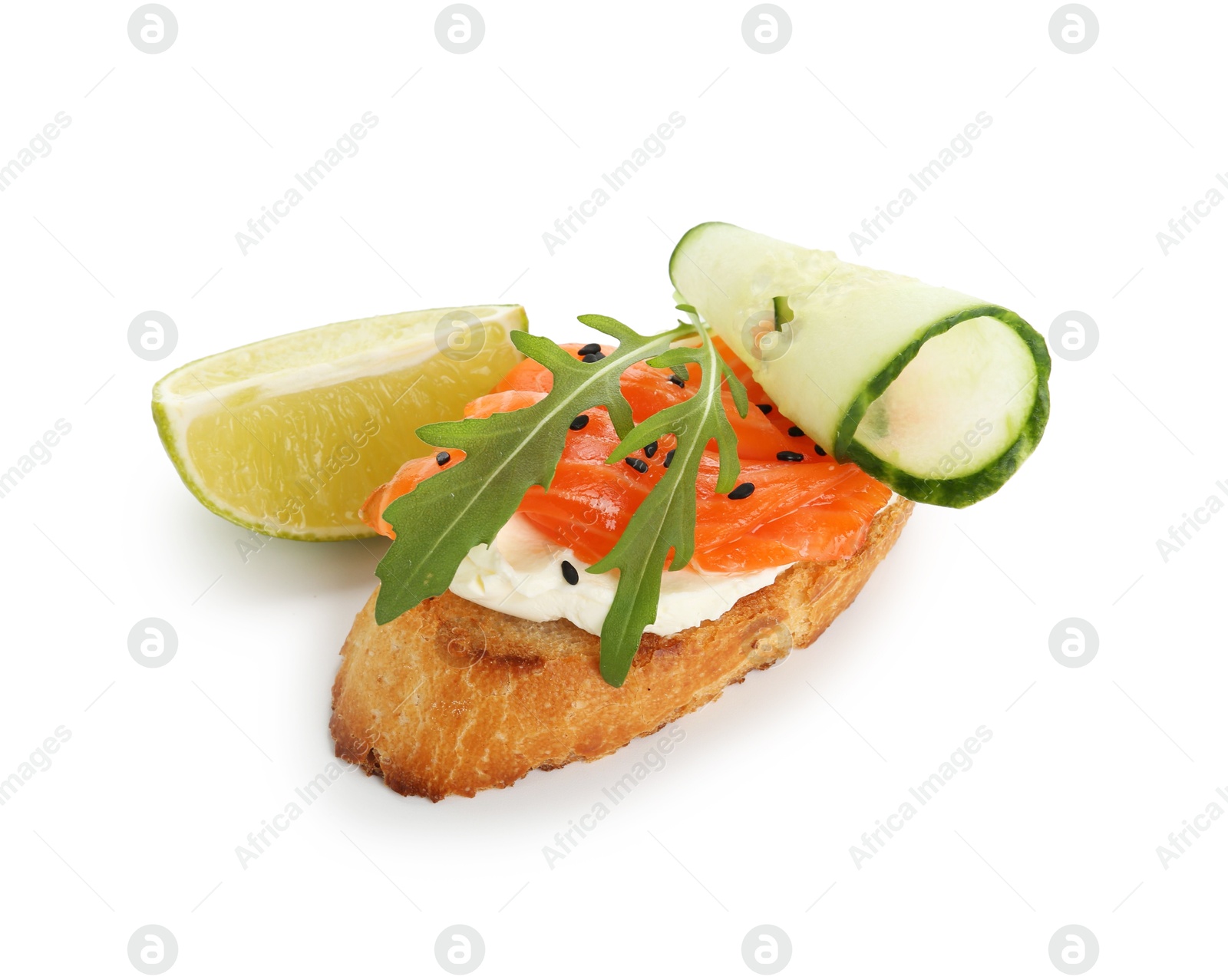 Photo of Delicious bruschetta with cream cheese, salmon, cucumber and piece of lime isolated on white