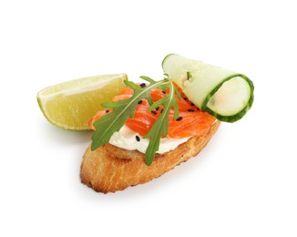 Photo of Delicious bruschetta with cream cheese, salmon, cucumber and piece of lime isolated on white