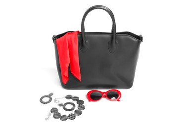 Photo of Stylish bag and other accessories on white background