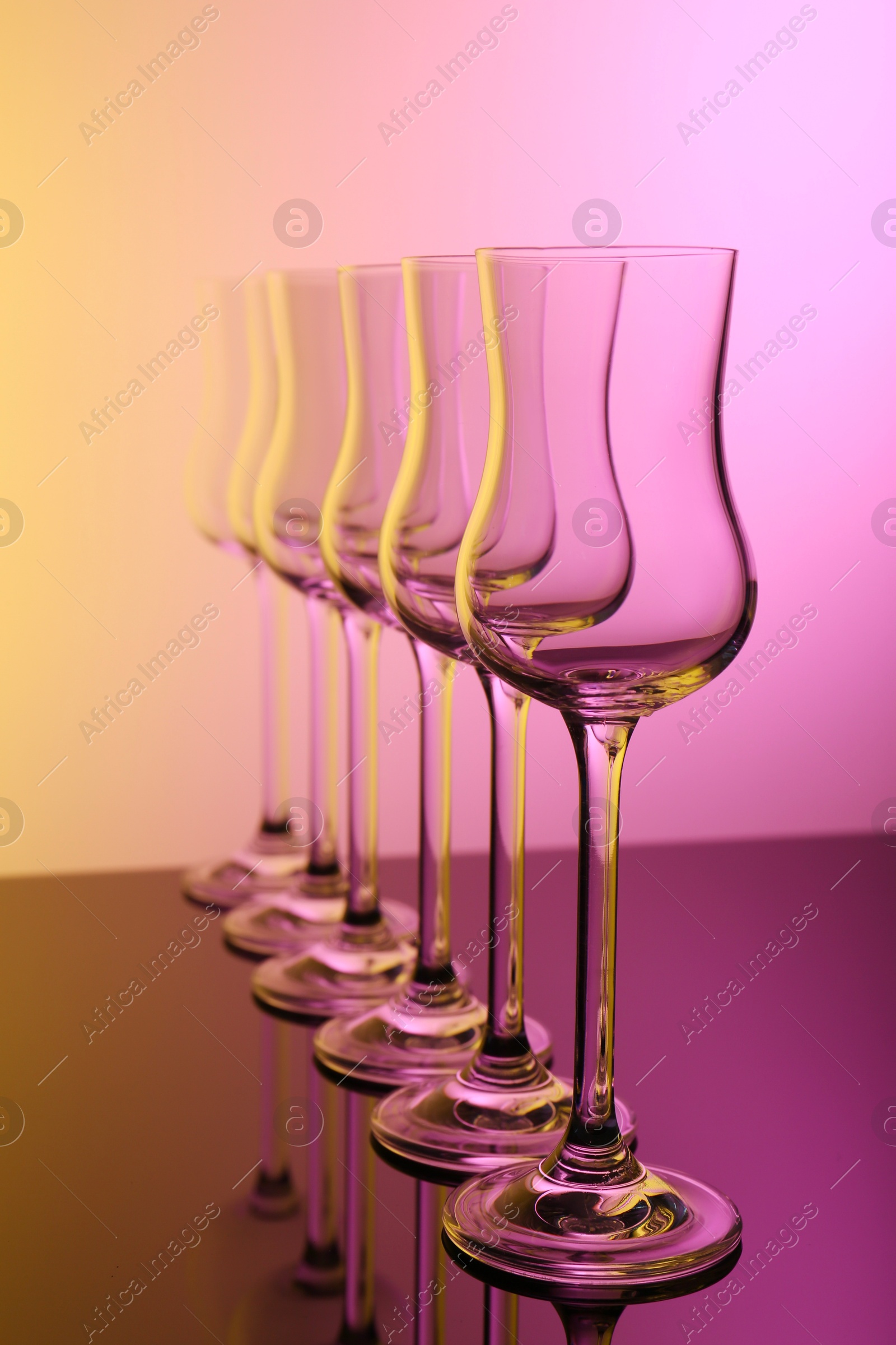 Photo of Empty glasses on table, color tone effect