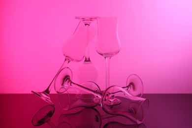 Photo of Empty glasses on table, color tone effect