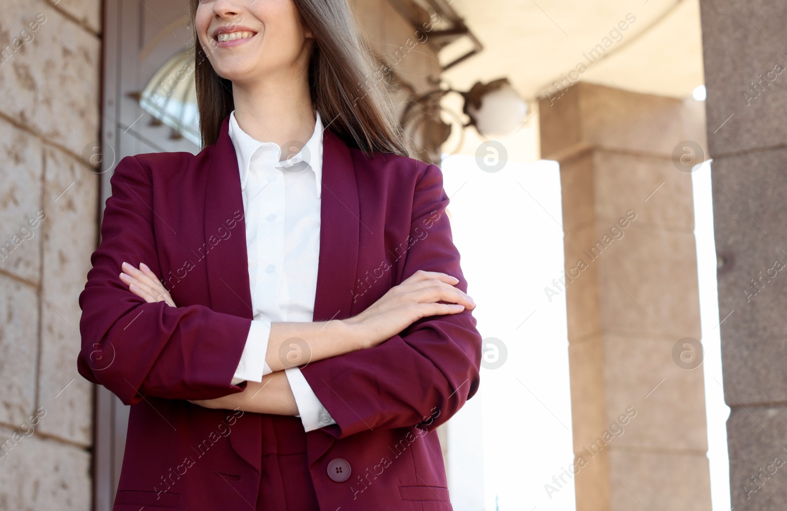 Photo of Young woman wearing stylish suit outdoors, closeup. Space for text