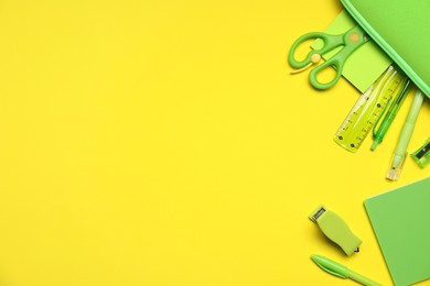Photo of Different stationery on yellow background, flat lay. Space for text