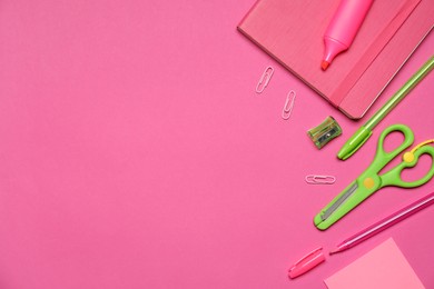 Photo of Different stationery on pink background, flat lay. Space for text