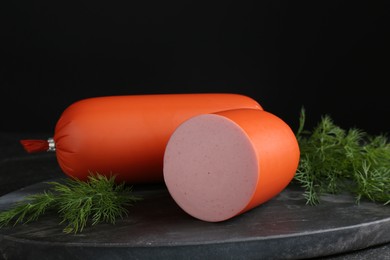 Photo of Tasty boiled sausages and dill on table, closeup