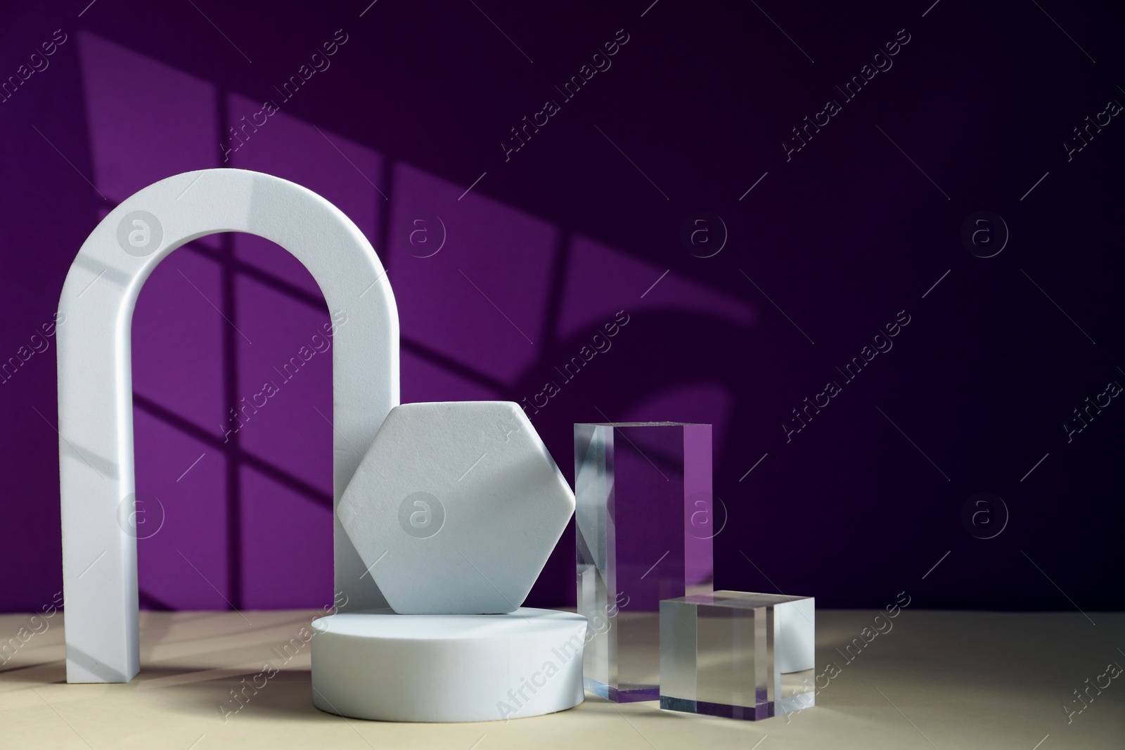 Photo of Different geometric shapes on color background, space for text. Stylish presentation of product