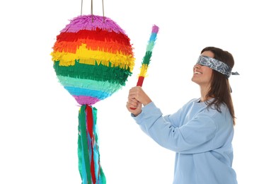 Photo of Woman with tied eyes breaking pinata on white background