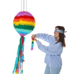 Photo of Woman with tied eyes breaking pinata on white background