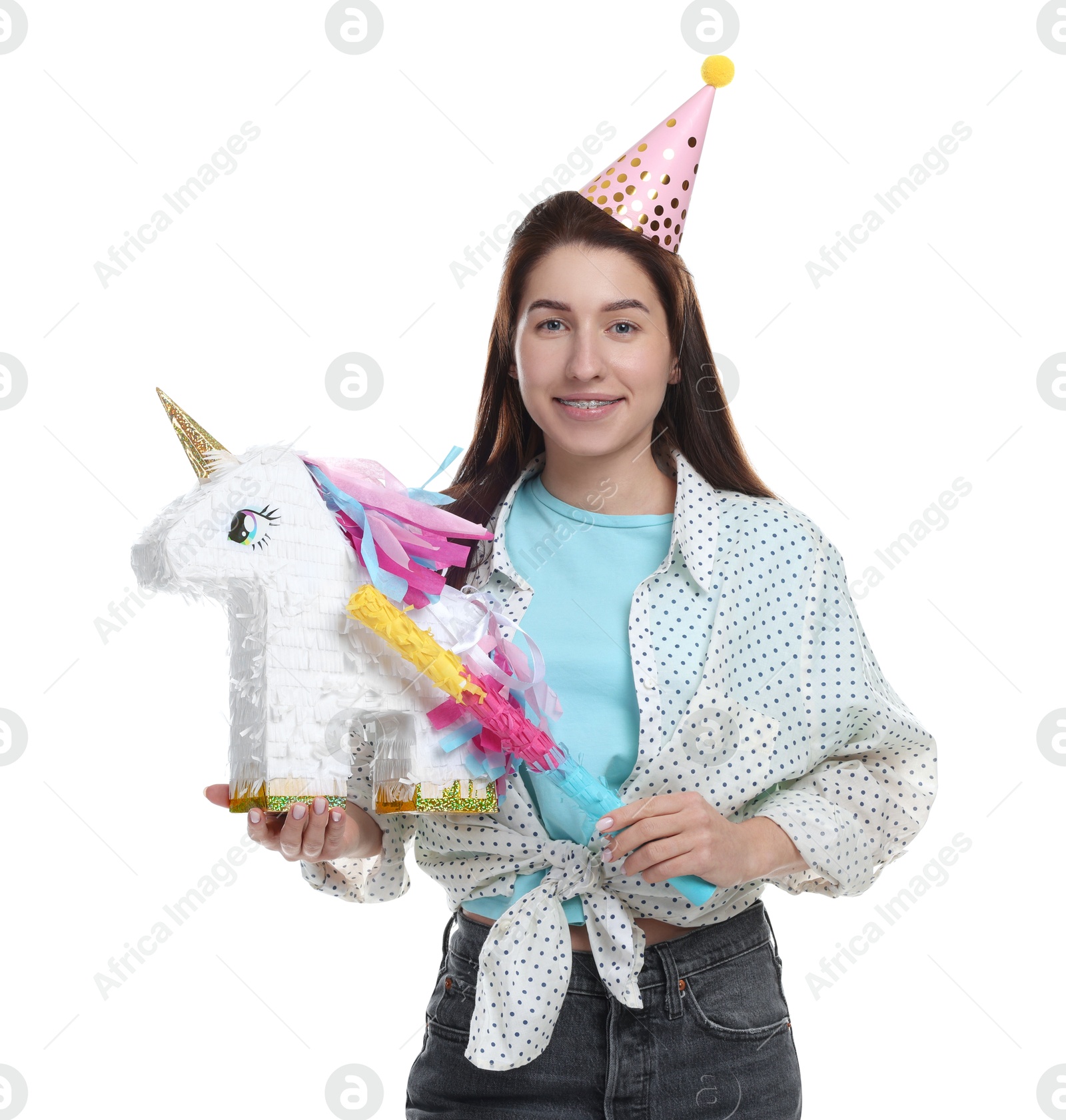 Photo of Happy woman with unicorn shaped pinata and stick on white background