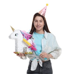 Photo of Happy woman with unicorn shaped pinata and stick on white background