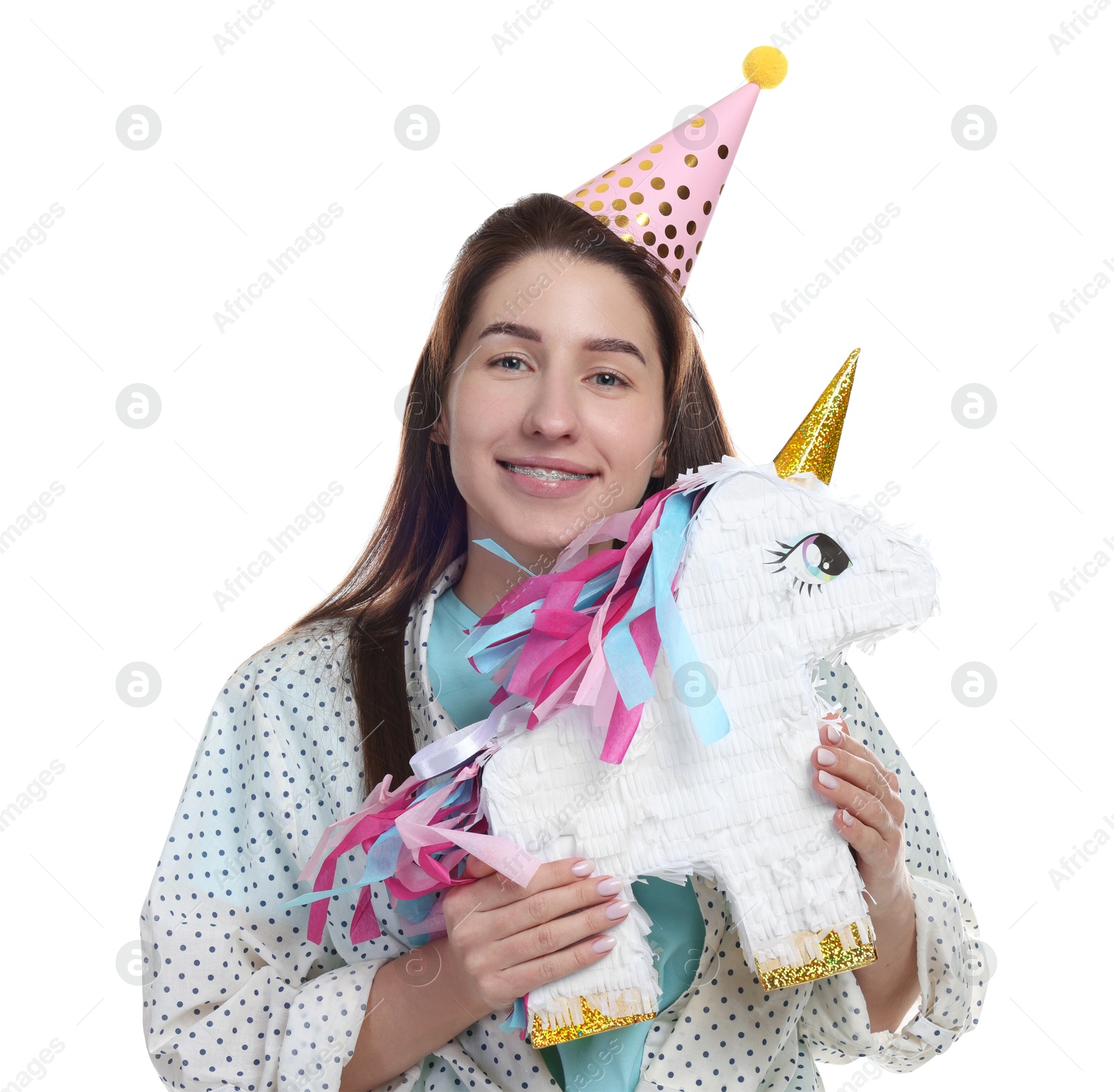 Photo of Happy woman with unicorn shaped pinata on white background