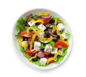 Photo of Delicious fresh Greek salad in bowl on white background, top view