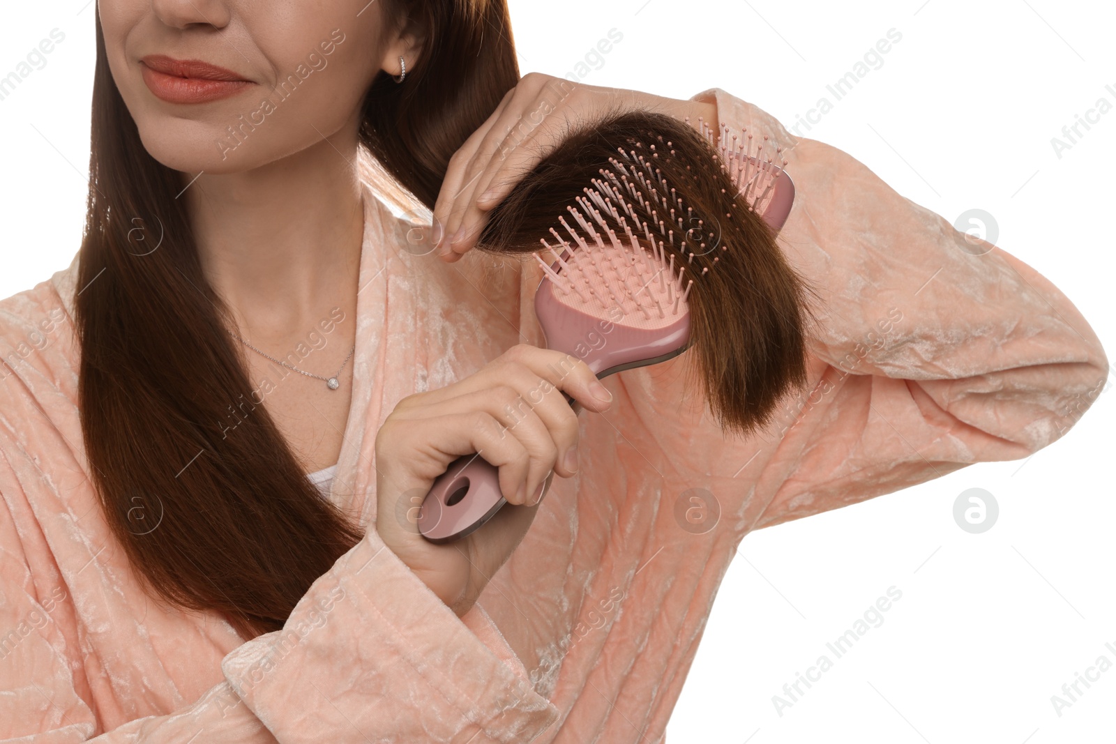 Photo of Woman brushing her hair on white background, closeup