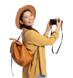 Photo of Traveller with backpack taking photo on white background