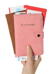 Photo of Woman holding passports with tickets on white background, closeup