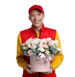 Photo of Smiling delivery man holding gift box with beautiful floral composition on white background