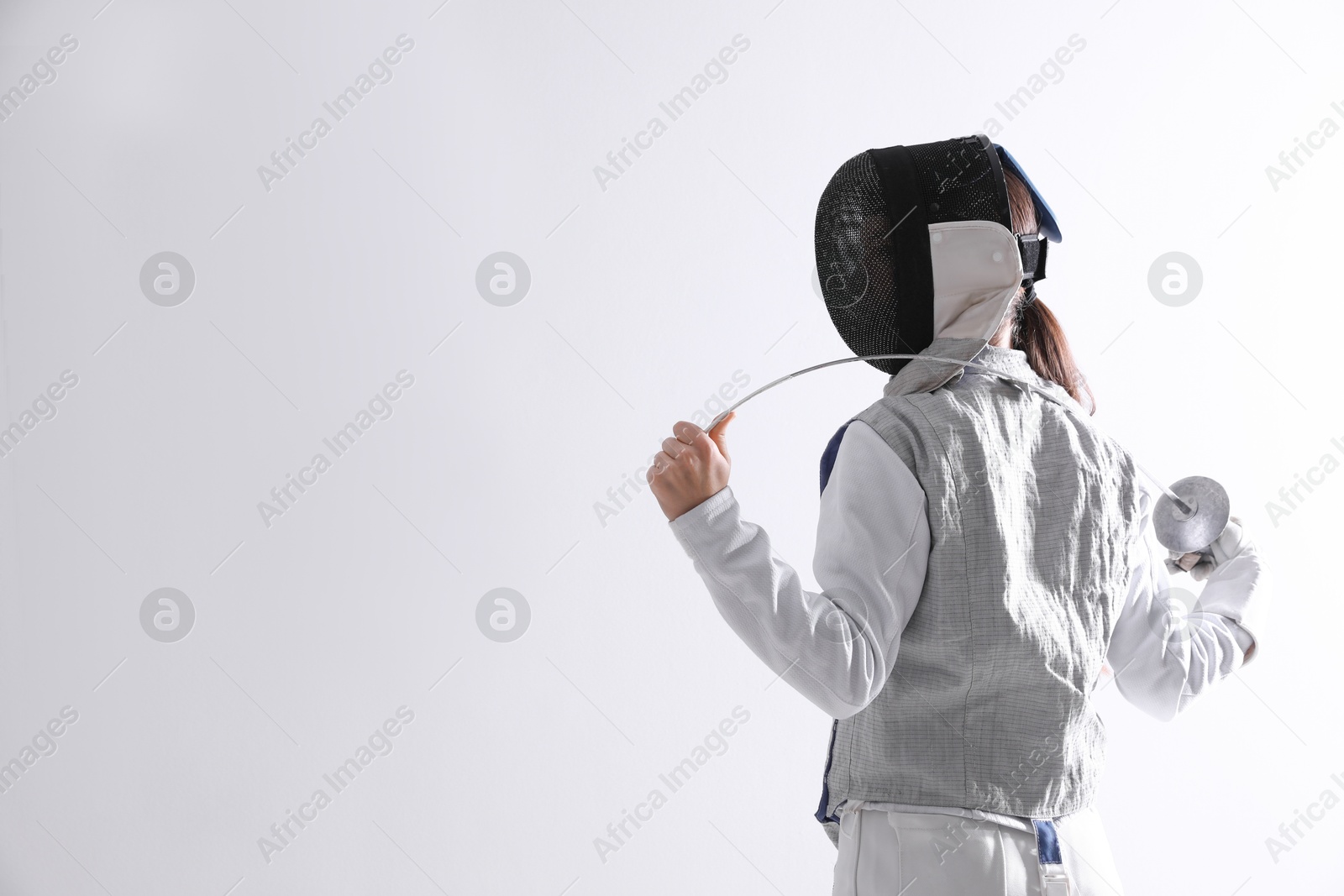 Photo of Fencer with epee on white background, space for text