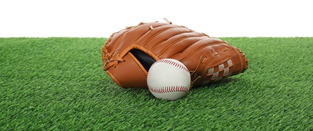 Photo of Baseball ball and glove on green grass against white background. Sport equipment