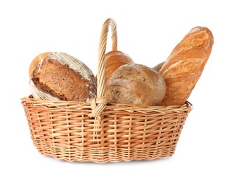 Photo of Different freshly baked bread loafs in wicker basket isolated on white