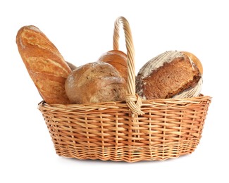 Photo of Different freshly baked bread loafs in wicker basket isolated on white