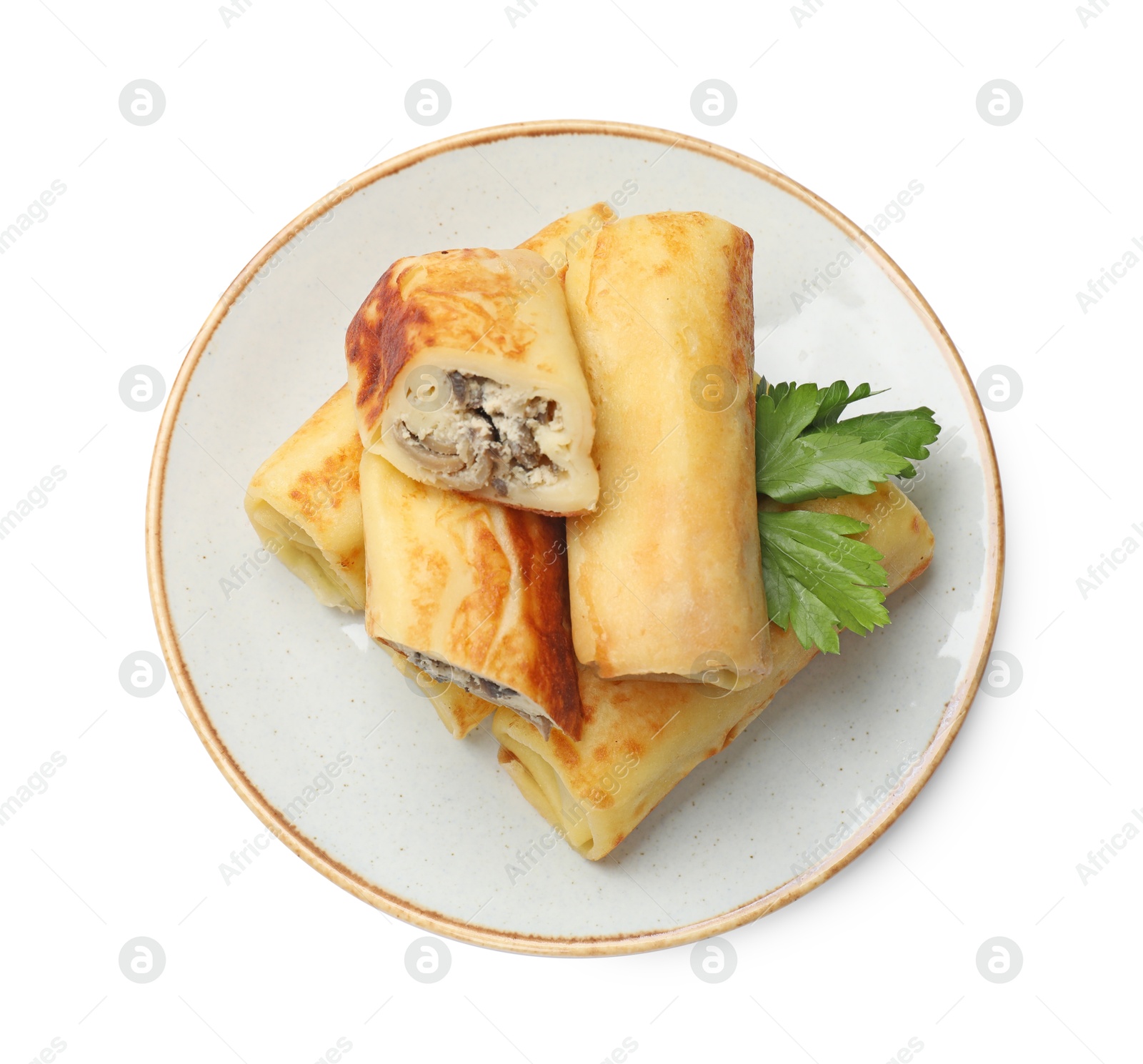 Photo of Delicious rolled crepes with mushrooms and parsley isolated on white, top view