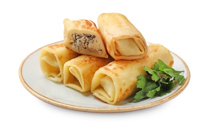 Photo of Delicious rolled crepes with mushrooms and parsley isolated on white