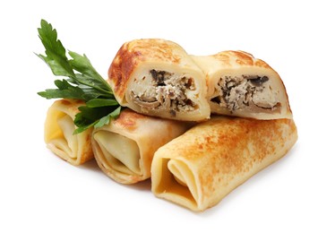 Photo of Delicious rolled crepes with mushrooms and parsley isolated on white